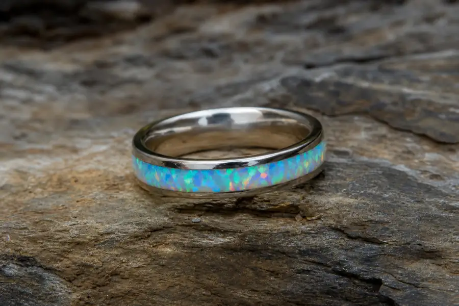 An opal inlay band turned to catch the play of colour