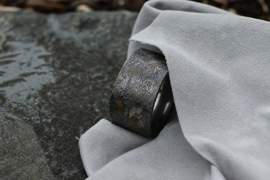 A meteorite band being dried carefully with a cloth