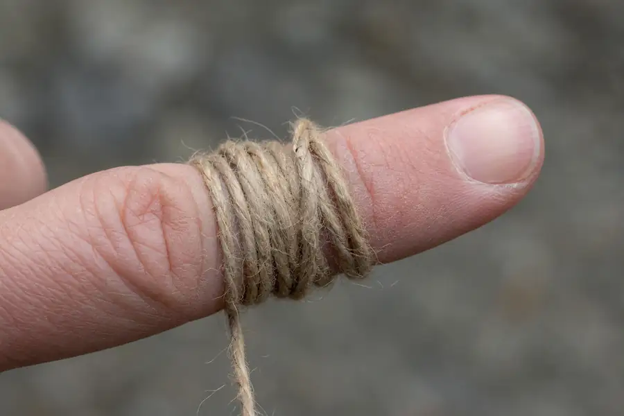 The string method being wound around a finger